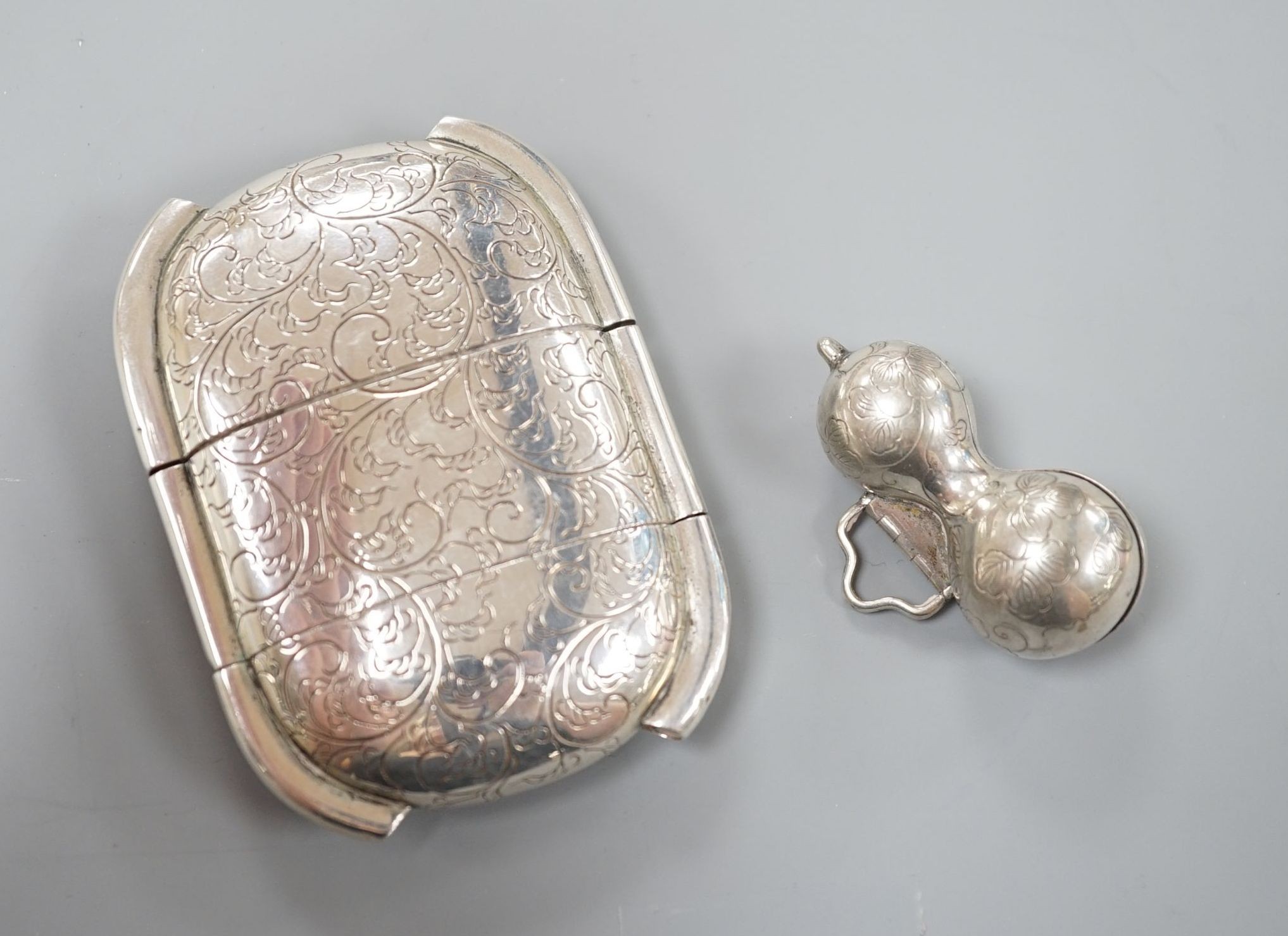 A late 19th century Japanese white metal two cased inro, 83mm and a similar single cased gourd shaped inro?